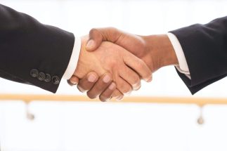 Sealing a deal. Close-up of business men shaking hands